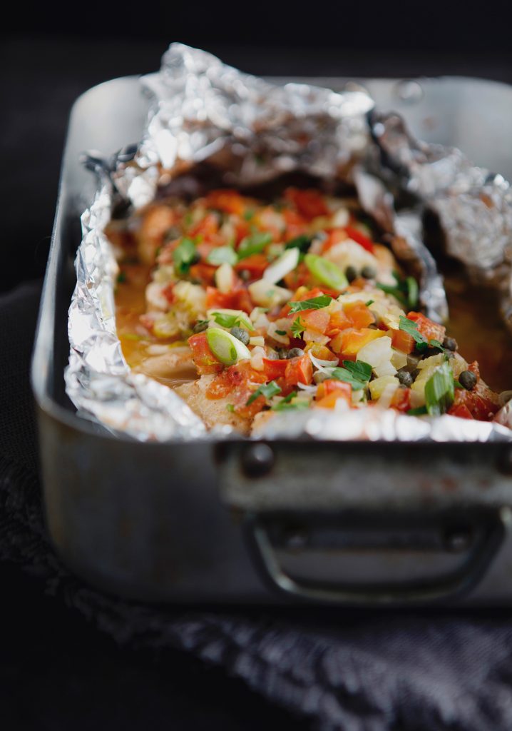 Tomato, celery and capers haddock baked en papillote