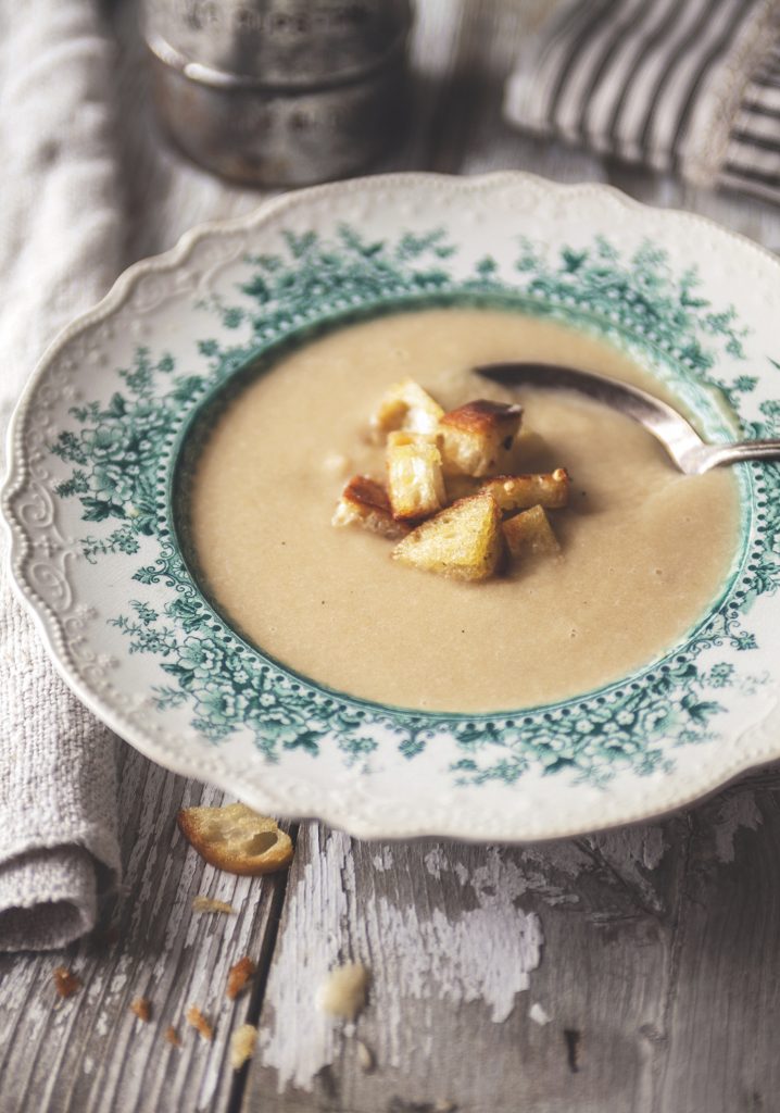Creamy caramelized onion soup with garlic croutons